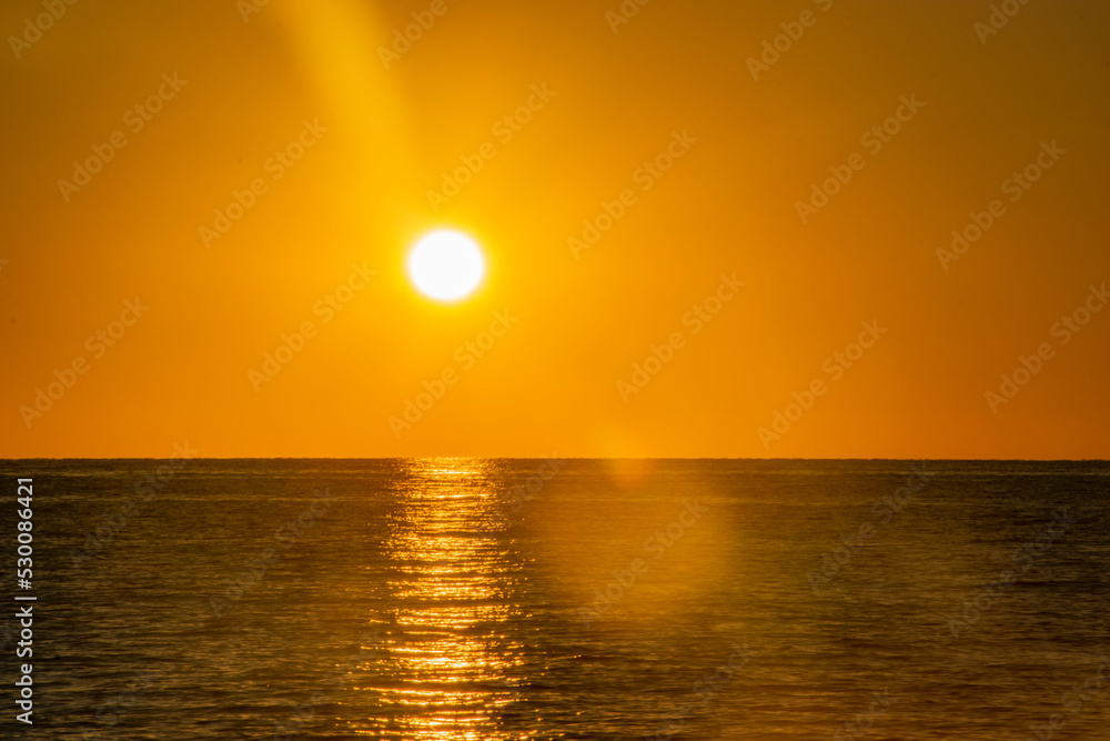 yellow sunset in the big sea
