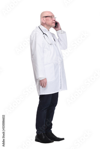 man doctor talking on a mobile phone. isolated on a white background.