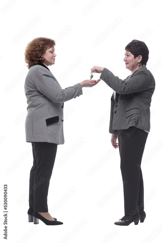 in full growth. real estate agent handing keys to his client in full growth. real estate agent handing keys to his client