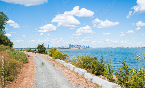 Hiking on Spectacle Island with a great view of the Boston Skyline in the distance.