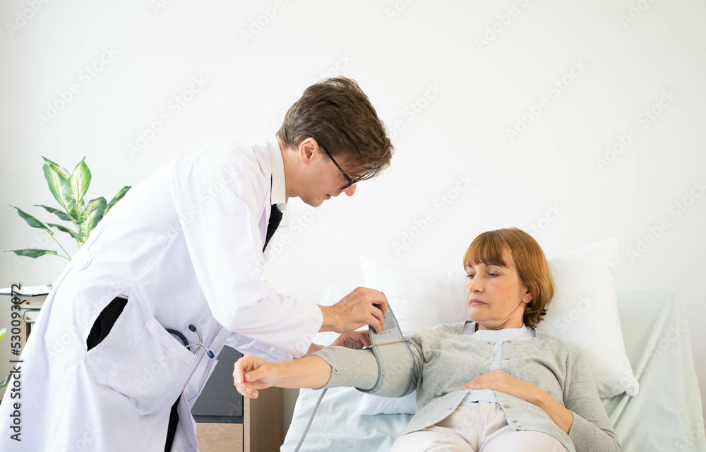Obraz premium Asian senior adult retired stay at nursing home with take care healthcare and medicine by doctor and nurse. old elderly people working out exercise at nursing home, training and physical therapy,
