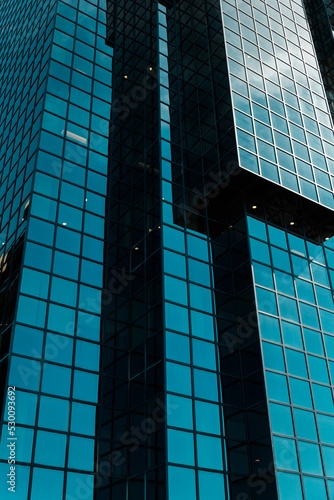 modern office building in the city blue glass skyscrapper reflection of the sky simetric lines photo