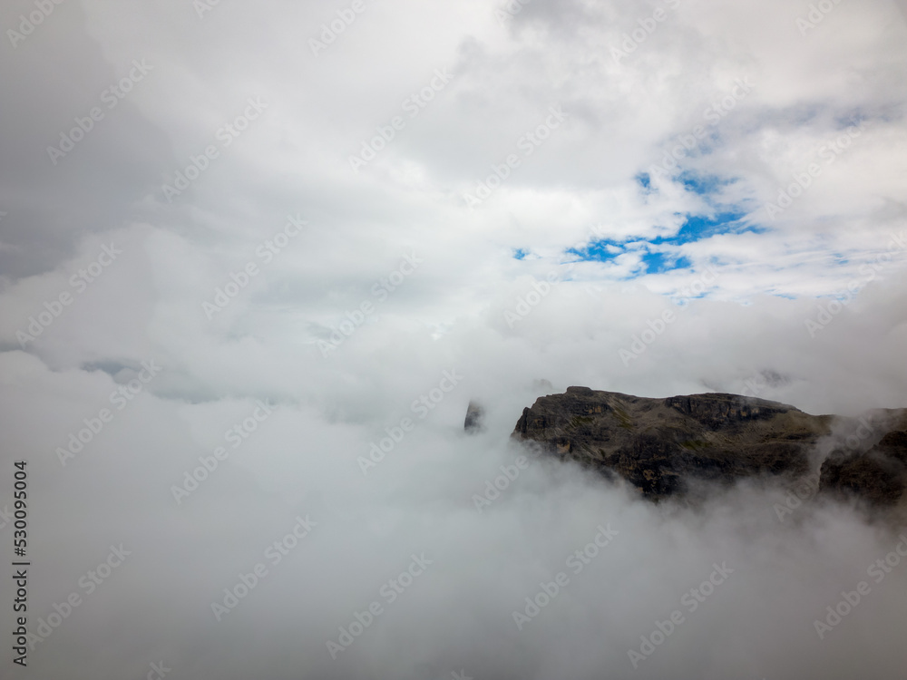 Mountain in clouds in Dolomites Italy