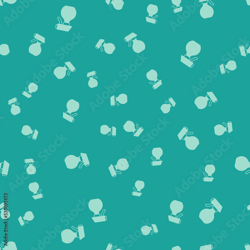 Green Water spray bottle icon isolated seamless pattern on green background. Sprinkler for ironing. Vector