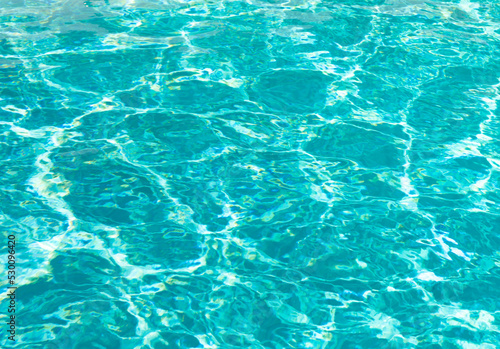 blue color background of swimming pool water with ripples in malibu