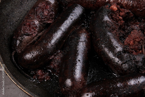 Whole blood sausages on a metal pan,Traditional latvian blood sausages