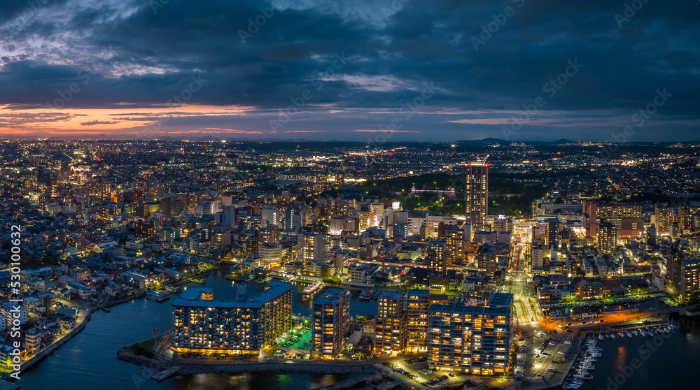 Aerial view of buildings in Akashi City center at night