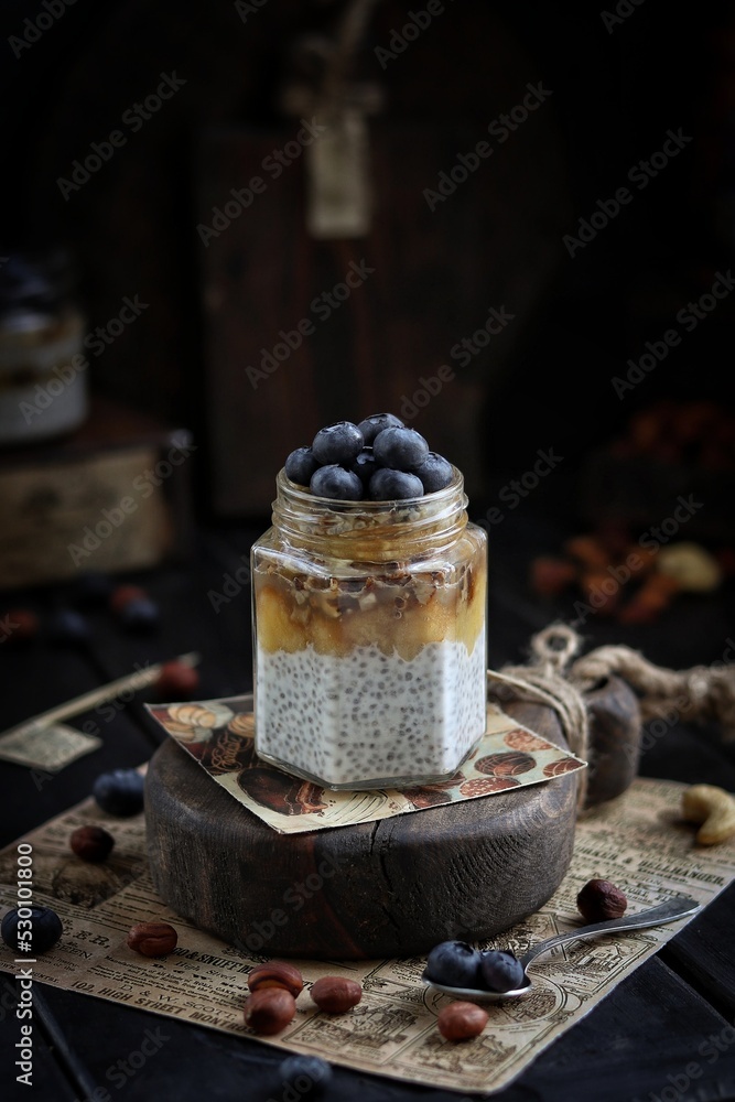Chia pudding with nuts and blueberries in a jar Chia pudding with nuts and blueberries in a jar