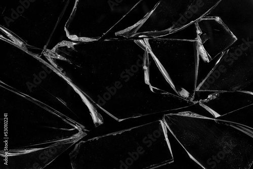 Shards of broken glass on a black background.