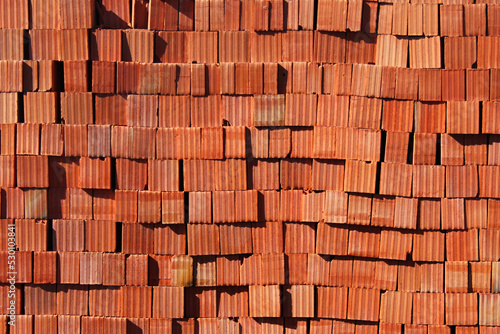 Stacks of red bricks as background