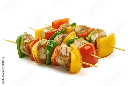 Kebab - grilled pork sausage skewers and vegetables BBQ, close-up, isolated on white background.