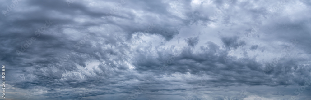 dark blue sky background with fluffy rain clouds. Sky panorama.