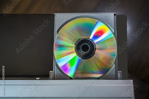 close-up vintage cd player with cd. DVD inserting to video player.
