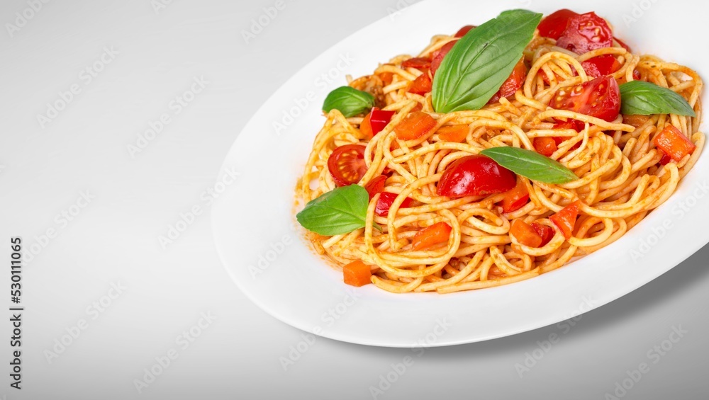 Traditional Italian pasta dish with tomatoes in the plate