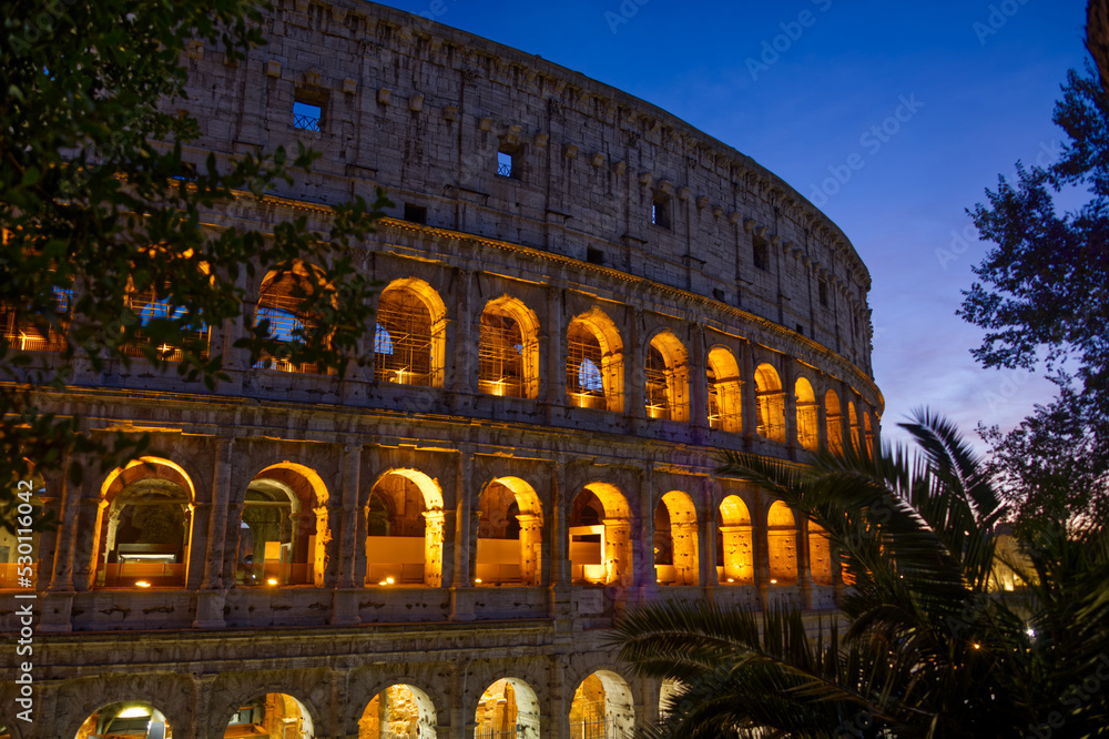 The  Colosseum located in Rome Italy is an oval amphitheater in the centre of the city. It is the largest ancient amphitheater ever built.