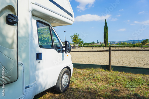 motorhome in front of a landscape