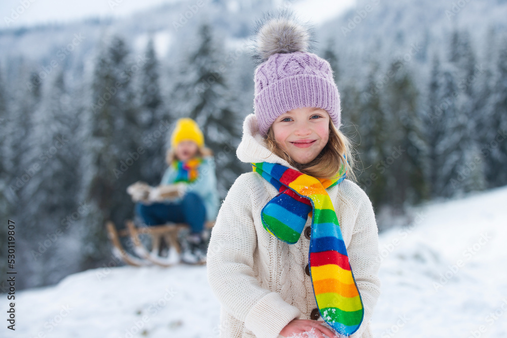 Funny child, cute girl playing in winter snowy park. Christmas holiday, winter weekend for kids.