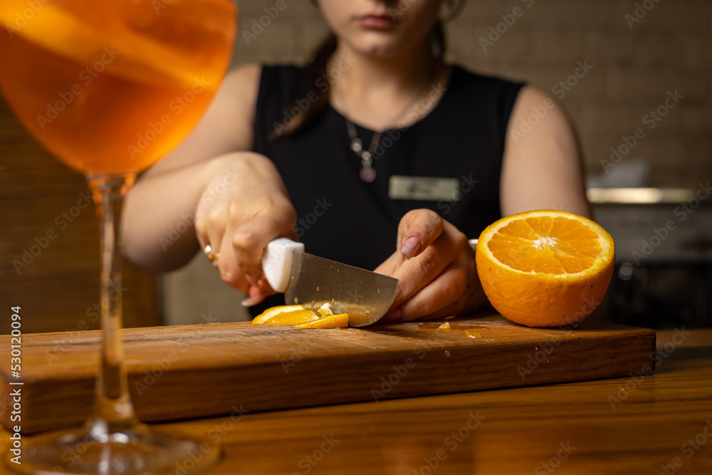 A bartender prepares a cocktail at the restaurant bar
A bartender prepares a cocktail at the restaurant bar