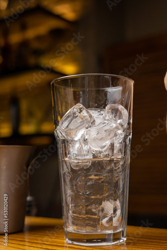 A bartender prepares a cocktail at the restaurant bar

