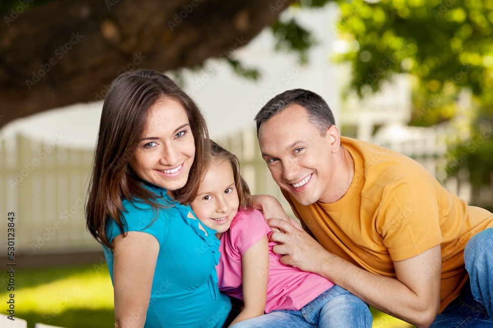 Happy family with a child playing on outdoor Happy family with a child playing on outdoor
