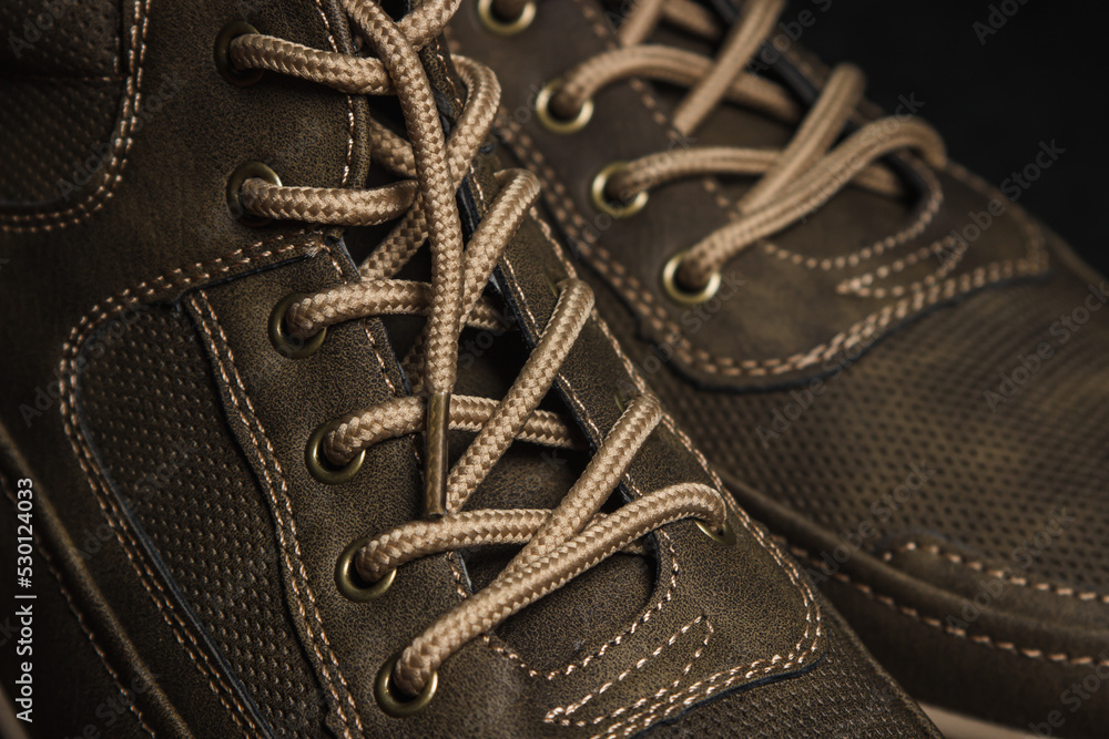 Lacing men's shoes close-up. Autumn men's shoes Lacing men's shoes close-up. Autumn men's shoes