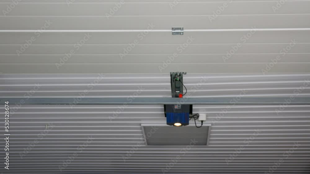 An opening door and an automatic garage door opening mechanism with an