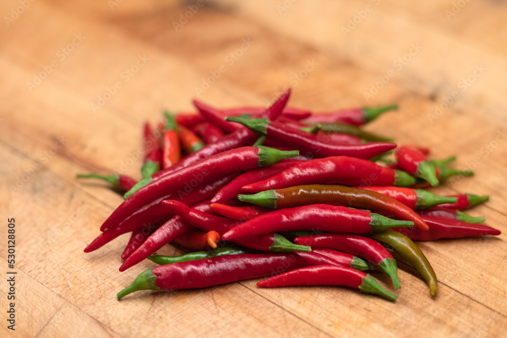 red hot chili Thai peppers on wooden background cutting board red hot chili Thai peppers on wooden background cutting board