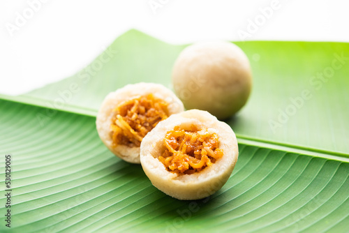 kozhukatta or kolukattai pidi is Steamed dumplings made with rice flour, filling coconut, jaggery photo