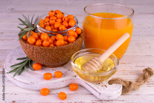 Vitamin drink. Sea buckthorn juice with honey. photo