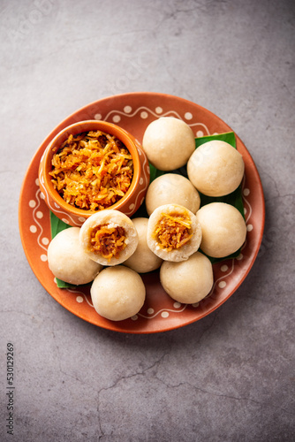 kozhukatta or kolukattai pidi is Steamed dumplings made with rice flour, filling coconut, jaggery photo