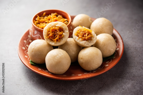 kozhukatta or kolukattai pidi is Steamed dumplings made with rice flour, filling coconut, jaggery photo