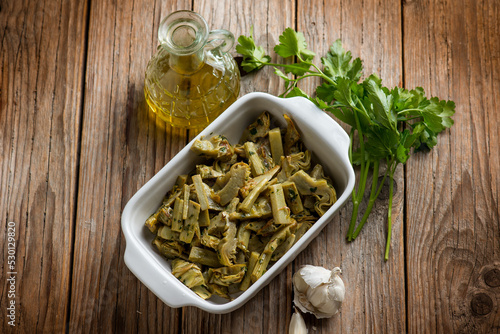 sauteed artichoke with garlic parsley and olive oil #530129820
