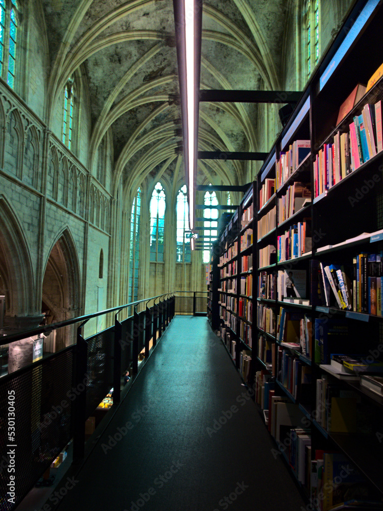 Maastricht, The Netherlands - July 2022: Visit the beautiful city of Maastricht - View of a magnificent library in a Dominican church	