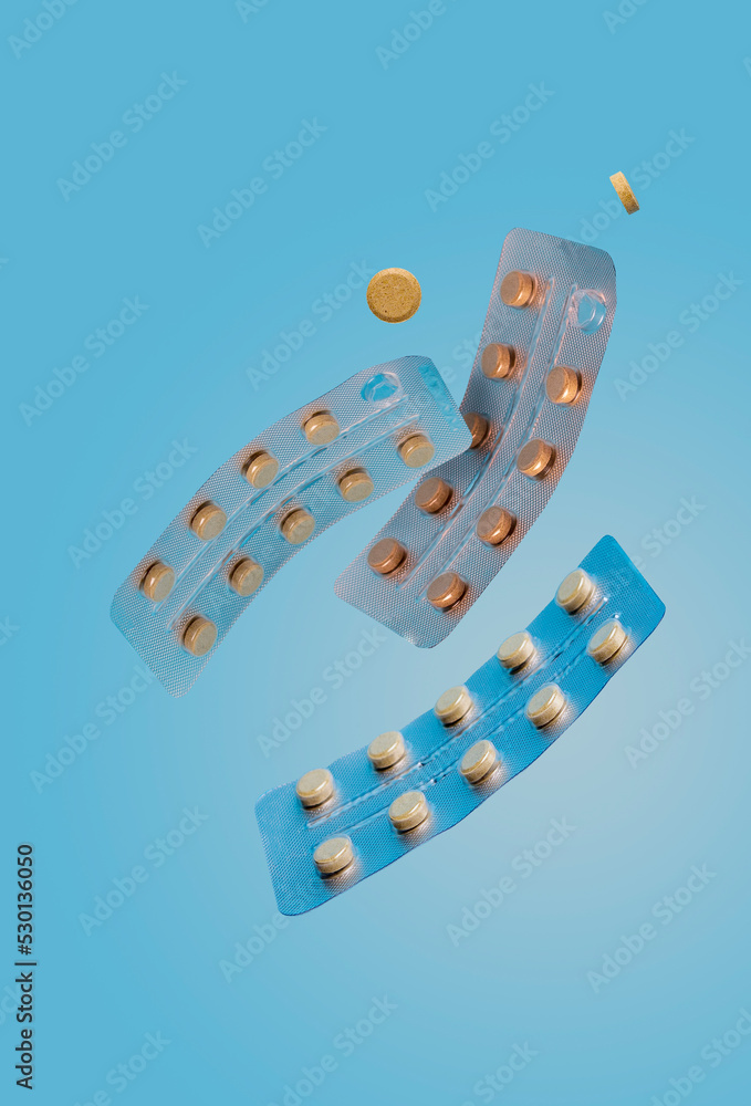 sage cough pills fly on a blue background sage cough pills fly on a blue background