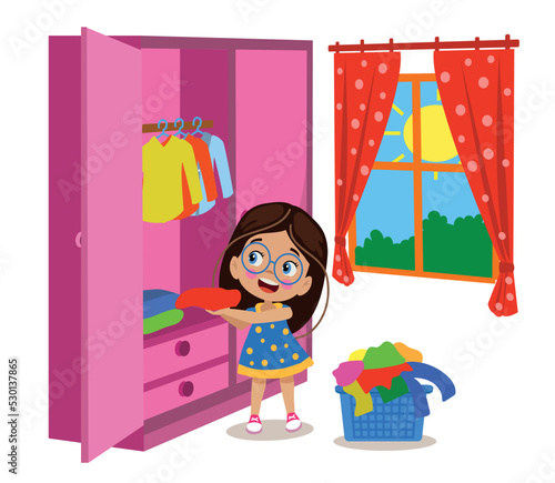 cute little girl tidying her room straightening her clothes