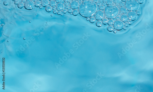 Fresh cool blue water background with bubbles
