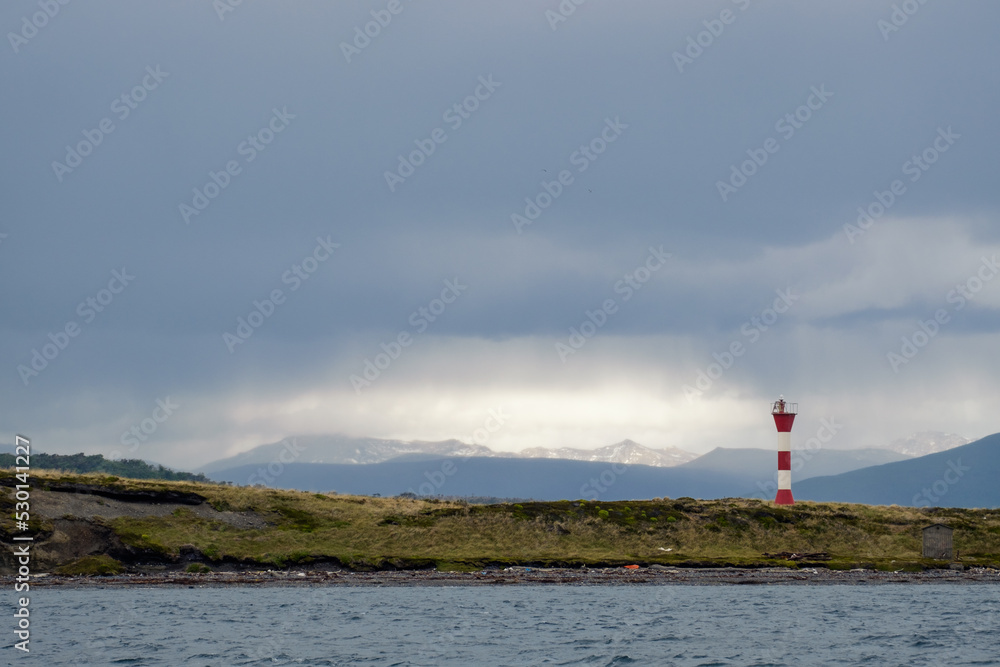 Dark clouds above a lighthouse on an island in the Beagle Channel.