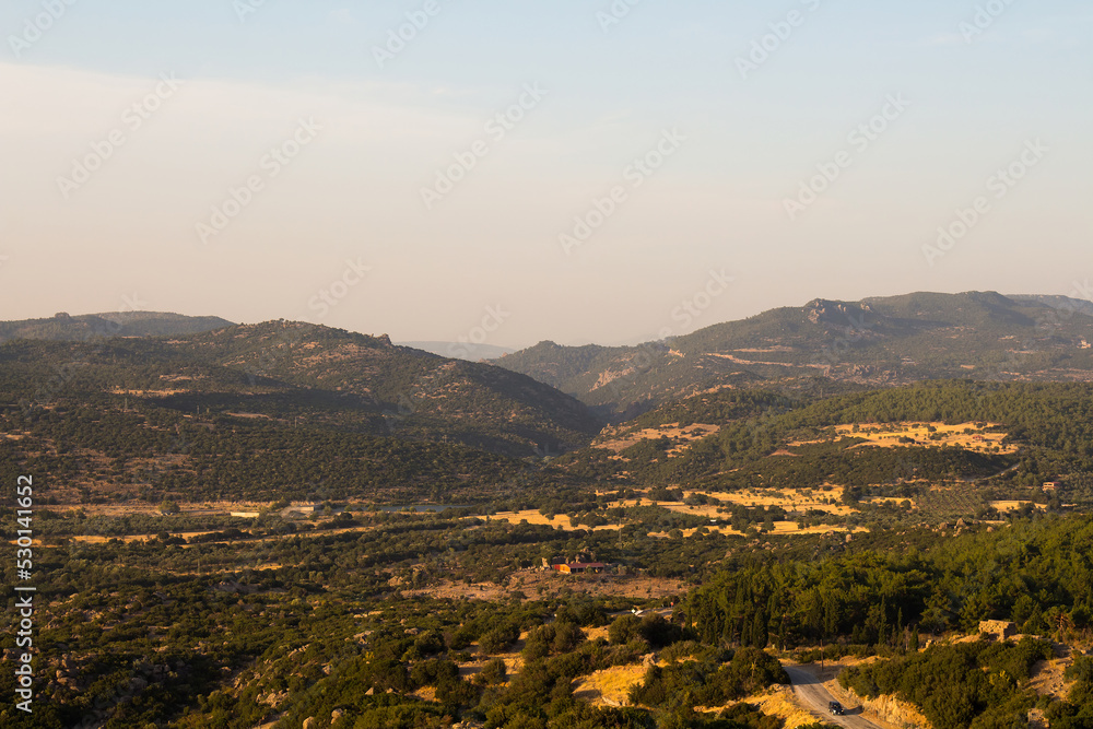 View of mountains and forests of Aegean landscape captured in Assos, Behramkale area of Turkey.
