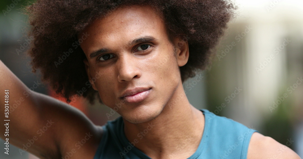 Serious young mixed black african man staring to camera portrait Serious young mixed black african man staring to camera portrait