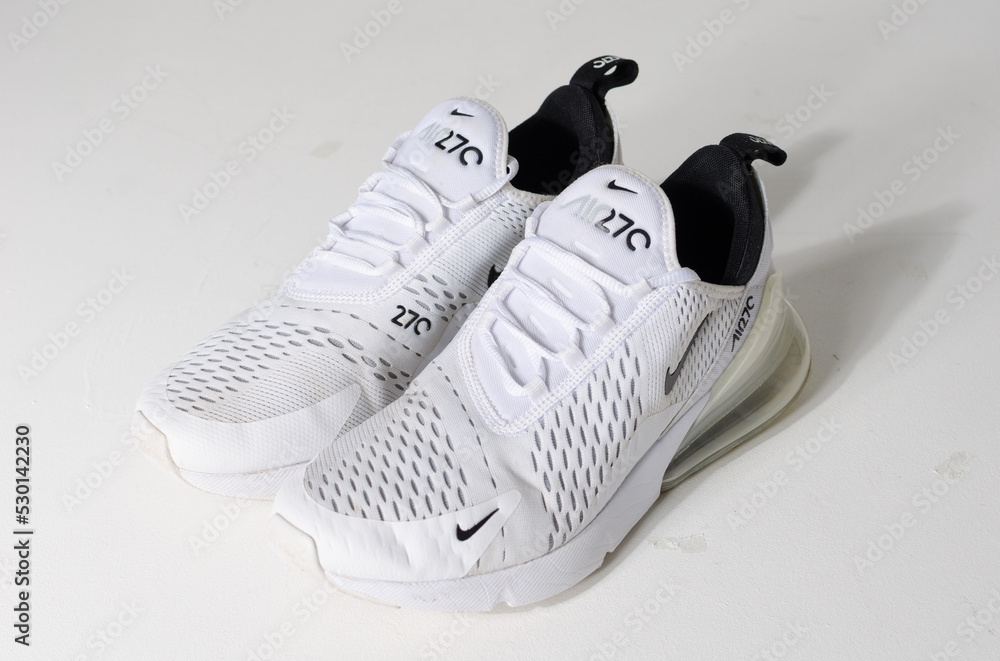 london, uk 05.08.2020 Nike Air Max 270 white low weight running trainers.  Nike air contemporary sneaker trainers. Nike sport and street wear  fashionable athletic apparel. Isolated nikes. Stock Photo | Adobe Stock