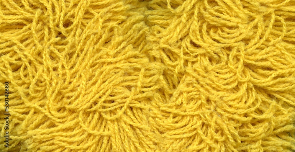 a yellow string background in the form of a pattern composed of numerous tangled, slightly fluffy strings - obrazy, fototapety, plakaty 