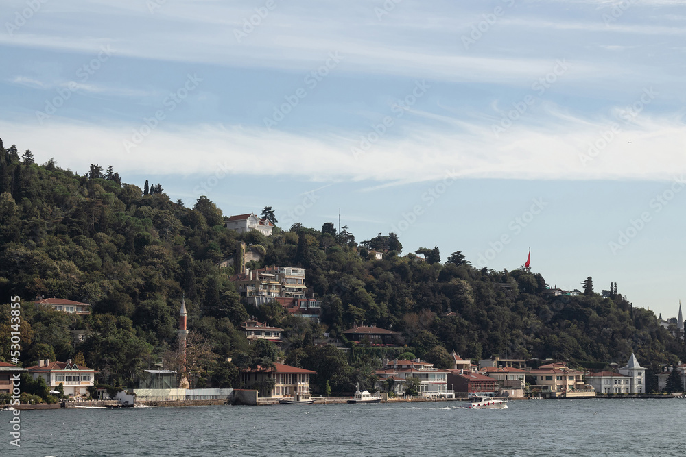 View of historical and traditional mansions by Bosphorus in Kandilli area of Asian side of Istanbul. It is a sunny summer day. Beautiful scene.