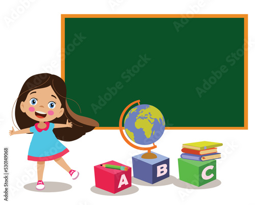 cute happy girl in front of school classroom blackboard