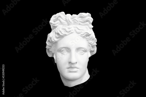 plaster cast woman head isolated on black background