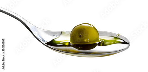 organic olive oil poured into the spoon