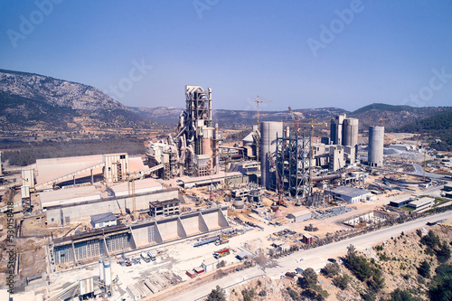 Wallpaper Mural Aerial view of huge cement producing plant located in mountainside