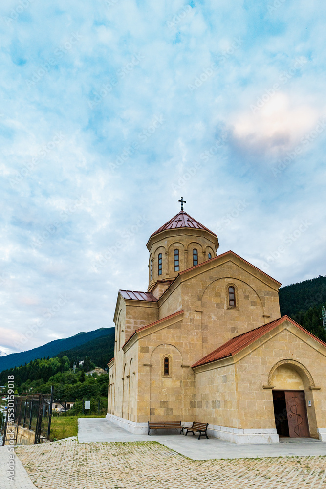 Saint Nicholas (Nikolai) church at sunset in Mestia, Svaneti region of Georgia. The church is a landmark in the town of Mestia
