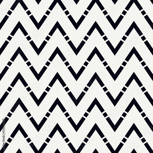 Zigzag lines background. Seamless pattern.Jagged stripes motif. Wavy linear ornament. Chevrons image. Striped backdrop. Geometric digital paper. Ethnic textile print. Tribal web design. Vector art.
