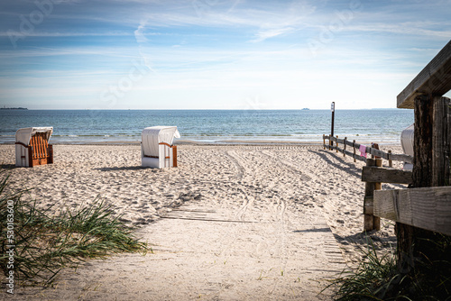 Fototapeta Naklejka Na Ścianę i Meble -   wooden path leads over the dunes to the Baltic Sea beach