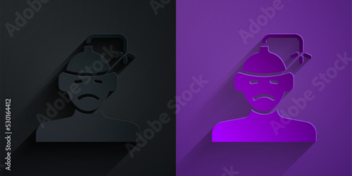 Paper cut Concussion, headache, dizziness, migraine icon isolated on black on purple background. Paper art style. Vector